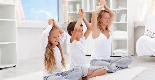 Balanced life – woman with kids doing yoga